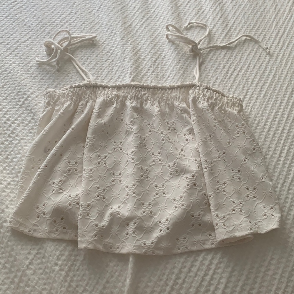 White, lacey top with ties. So cute for the summer.